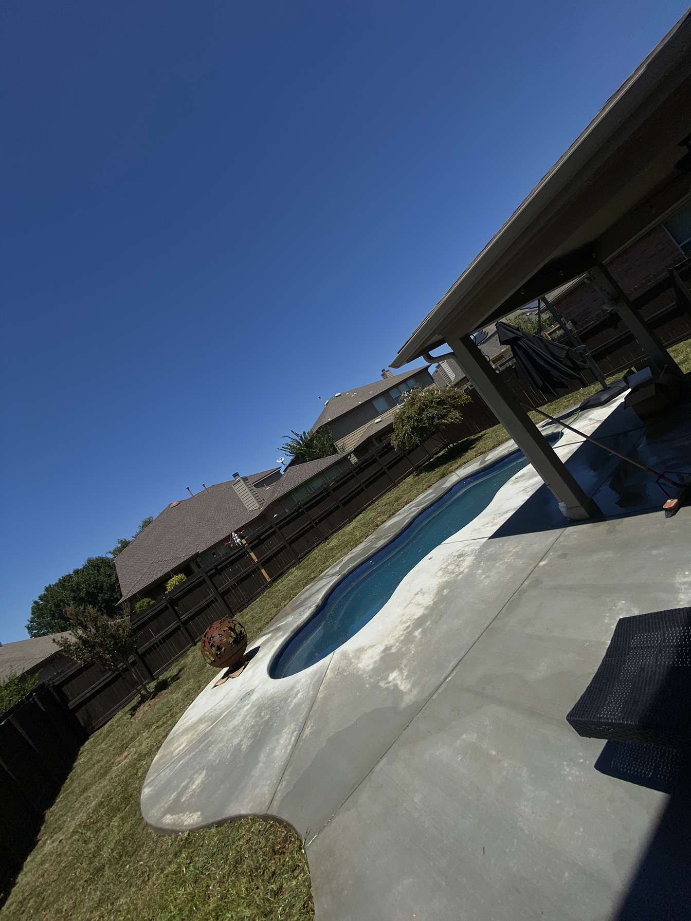 Concrete pool deck and landscaping