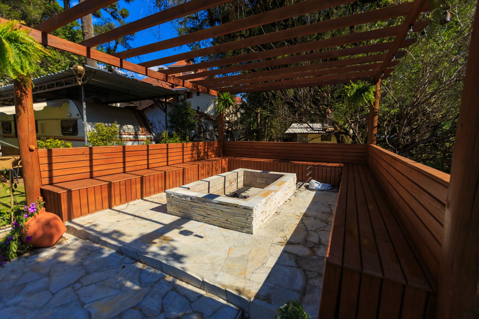 Backyard patio with a fire pit and seating